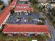 Aerial view showcasing the community's organized parking, well-maintained landscaping, and terracotta roofs at 1606 Sandy Point Sq # 53, Orlando, FL 32807