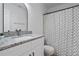Bathroom featuring a vanity with a granite top, decorative shower curtain, and modern fixtures at 1606 Sandy Point Sq # 53, Orlando, FL 32807