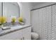 Bathroom featuring a vanity with a granite top, decorative shower curtain, and modern fixtures at 1606 Sandy Point Sq # 53, Orlando, FL 32807