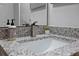 The bathroom features a new vanity, granite counter, and stainless faucet at 1606 Sandy Point Sq # 53, Orlando, FL 32807