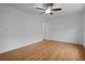 This is a bedroom featuring a ceiling fan and wood laminate flooring at 1606 Sandy Point Sq # 53, Orlando, FL 32807