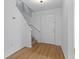 Bright entryway with light wood floors and staircase at 1606 Sandy Point Sq # 53, Orlando, FL 32807