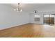 Living room with light wood floors, sliding doors, and a ceiling fan at 1606 Sandy Point Sq # 53, Orlando, FL 32807