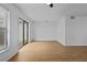 Bright living room featuring hardwood floors and a sliding glass door at 1606 Sandy Point Sq # 53, Orlando, FL 32807