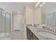 Elegant bathroom with double vanity and large shower at 1721 Kona Ln, Davenport, FL 33897