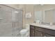 Bathroom with a walk-in shower, granite vanity, and toilet at 1721 Kona Ln, Davenport, FL 33897