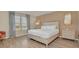 Comfortable main bedroom with a king-size bed and large windows at 1721 Kona Ln, Davenport, FL 33897