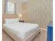 Well-lit bedroom featuring a patterned wall at 1721 Kona Ln, Davenport, FL 33897