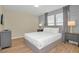 Bright bedroom with a queen-size bed and gray accents at 1721 Kona Ln, Davenport, FL 33897