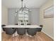 Bright dining room featuring a large table and modern chandelier at 1721 Kona Ln, Davenport, FL 33897