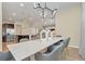 Modern dining room with marble table and stylish light fixture at 1721 Kona Ln, Davenport, FL 33897
