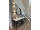 Stylish entryway with a console table, mirror, and modern lighting at 1721 Kona Ln, Davenport, FL 33897