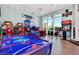 Fun game room with air hockey and arcade games at 1721 Kona Ln, Davenport, FL 33897