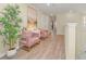Light and airy hallway with stylish seating at 1721 Kona Ln, Davenport, FL 33897