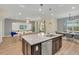 Open concept kitchen with large island and modern features at 1721 Kona Ln, Davenport, FL 33897