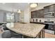 Large kitchen island with seating and granite countertops at 1721 Kona Ln, Davenport, FL 33897