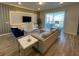 Spacious living room with sectional sofa and modern decor at 1721 Kona Ln, Davenport, FL 33897