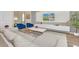 Modern living room with sectional sofa and large TV at 1721 Kona Ln, Davenport, FL 33897