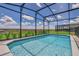 Screened in pool with a view of the surrounding area at 1721 Kona Ln, Davenport, FL 33897