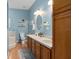 Bathroom with double vanity, soaking tub, and separate shower at 19106 Sheldon St, Orlando, FL 32833