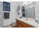 Bathroom with single vanity and patterned shower curtain at 19106 Sheldon St, Orlando, FL 32833