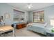 Bedroom with pool view, desk, and ceiling fan at 19106 Sheldon St, Orlando, FL 32833