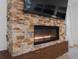 Modern fireplace with stone surround at 19106 Sheldon St, Orlando, FL 32833