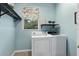 Laundry room with washer, dryer and shelving at 19106 Sheldon St, Orlando, FL 32833