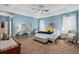Large main bedroom with ceiling fan and carpeted floor at 19106 Sheldon St, Orlando, FL 32833