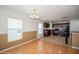 Light and airy dining area with wood floors and adjacent kitchen at 201 Magical Way, Kissimmee, FL 34744