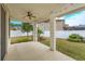 Covered back patio with ceiling fan and string lights at 2232 Donahue Dr, Ocoee, FL 34761