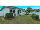 House backyard with fenced yard and manicured lawn at 2232 Donahue Dr, Ocoee, FL 34761
