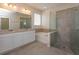 Double vanity bathroom with soaking tub and glass shower at 2232 Donahue Dr, Ocoee, FL 34761