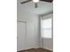 Simple bedroom with double door closet and window with blinds at 2232 Donahue Dr, Ocoee, FL 34761