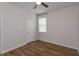 Bedroom with hardwood floors and a window with blinds at 2232 Donahue Dr, Ocoee, FL 34761