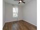 Bright bedroom with laminate wood floor and sheer curtains at 2232 Donahue Dr, Ocoee, FL 34761