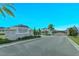 Community entrance with signage and gated access at 2232 Donahue Dr, Ocoee, FL 34761