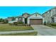 One-story home with brown garage door and landscaped front yard at 2232 Donahue Dr, Ocoee, FL 34761