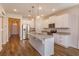 Modern kitchen with white cabinets, stainless steel appliances, and an island at 2232 Donahue Dr, Ocoee, FL 34761