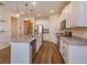 Modern kitchen with white cabinets, stainless steel appliances, and an island at 2232 Donahue Dr, Ocoee, FL 34761