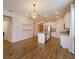 Open concept kitchen with island and white cabinets at 2232 Donahue Dr, Ocoee, FL 34761