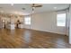Open concept kitchen and living room with hardwood floors and island at 2232 Donahue Dr, Ocoee, FL 34761