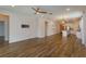 Open concept kitchen and living area with hardwood floors and modern lighting at 2232 Donahue Dr, Ocoee, FL 34761