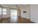 Bright living room with hardwood floors and sliding glass doors at 2232 Donahue Dr, Ocoee, FL 34761