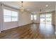 Spacious living room featuring hardwood floors and sliding glass doors at 2232 Donahue Dr, Ocoee, FL 34761