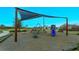 Community playground with shade structure and play equipment at 2232 Donahue Dr, Ocoee, FL 34761
