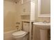 Bathroom with a white vanity, toilet and shower/tub combo at 257 Scottsdale Sq # 257, Winter Park, FL 32792