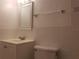 Bathroom with vanity, toilet, and mirrored medicine cabinet at 257 Scottsdale Sq # 257, Winter Park, FL 32792