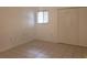 Simple bedroom with tile floors and window with blinds at 257 Scottsdale Sq # 257, Winter Park, FL 32792