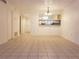 Spacious dining room with tile floors and a chandelier at 257 Scottsdale Sq # 257, Winter Park, FL 32792